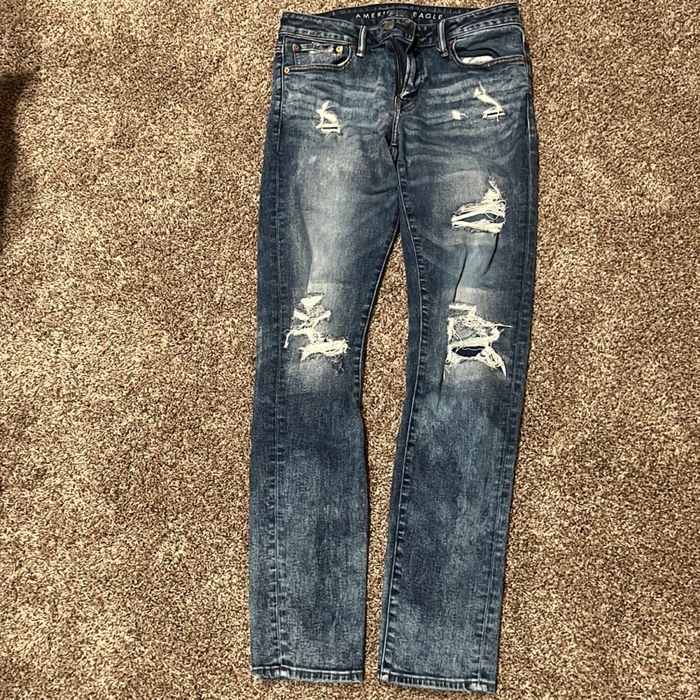 New, plastic tag is still on. American Eagle 32x34 distressed jeans